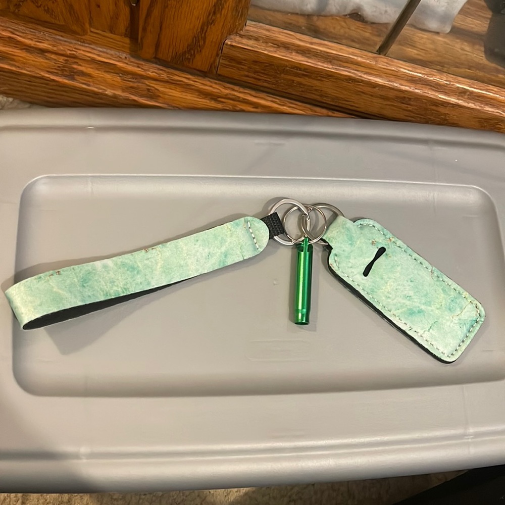 Chapstick holder with safety whistle